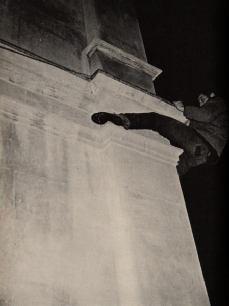 The climber has pulled himself up from a similar ledge just below the bottom of the picture and will repeat this operation to another ledge from which he will be able to reach the roof. Note the position of the left ledge, which is essential.