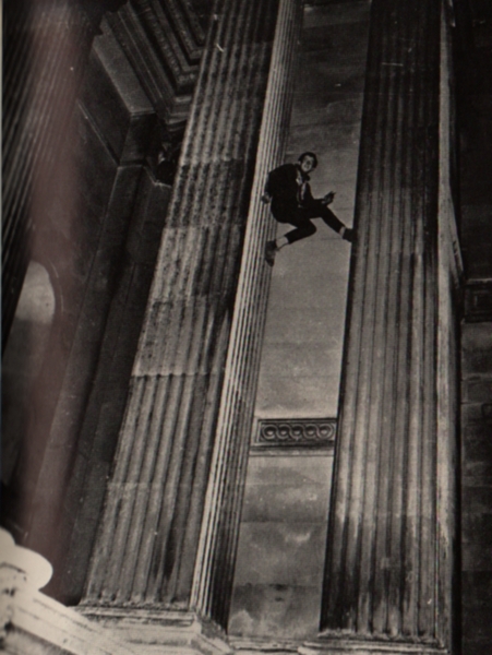 The climber relaxes with a cigarette to pose for the photograph.